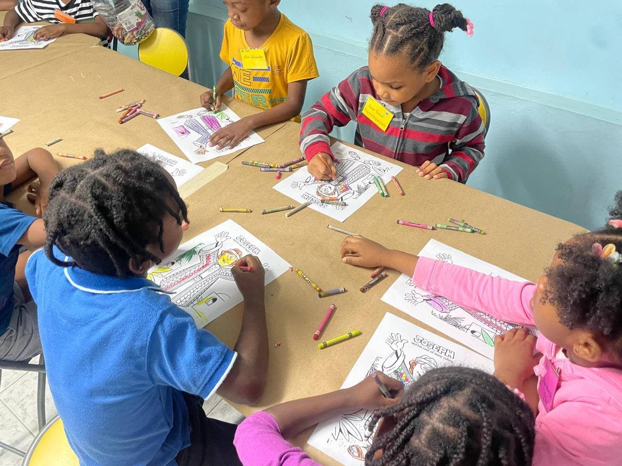 Kids participating in Bible lessons and group activities at VBS 2025