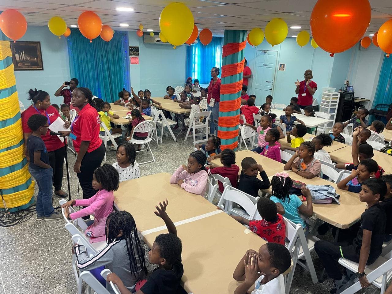 Group photo of children and volunteers at VBS 2025 Biblical Adventure